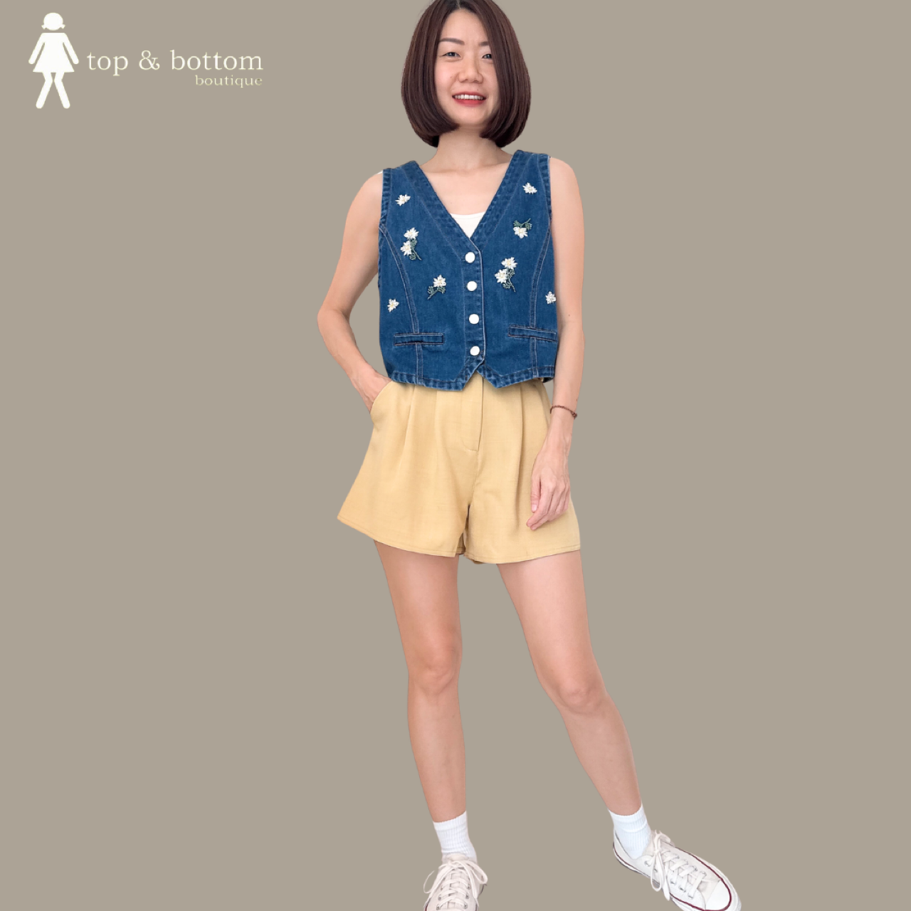 DENIM VEST WITH EMBROIDERED DAISY