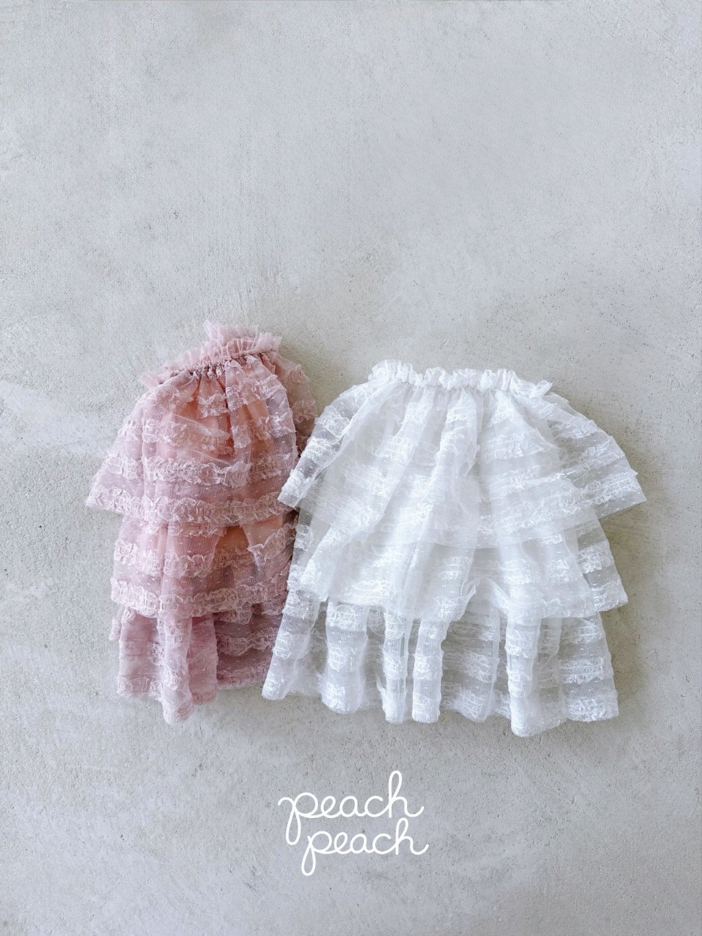 正韓秋PEACHPEACH 兩色蕾絲羽毛蛋糕裙