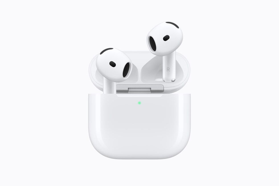 AirPods 5 charging case open with both earbuds inside and a green indicator