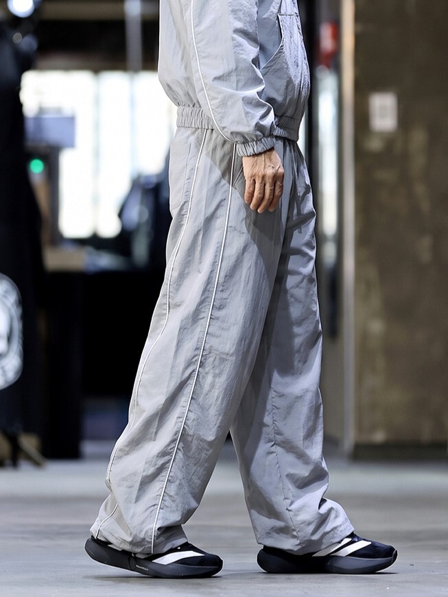 Nylon pants with linear detailing
