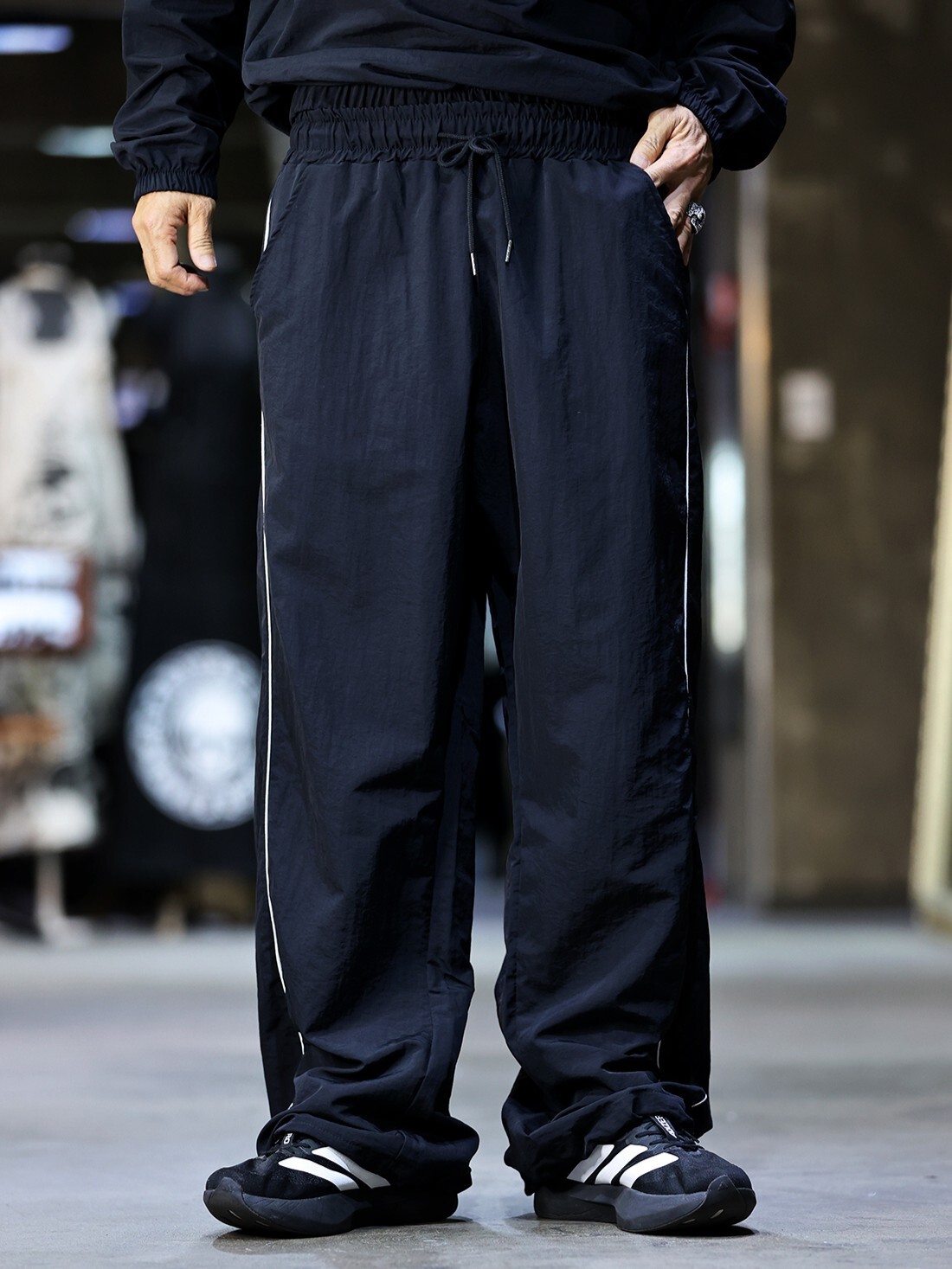 Nylon pants with linear detailing