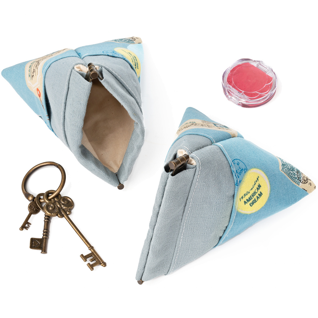 Triangle pouch opened to show the spring frame and lined interior