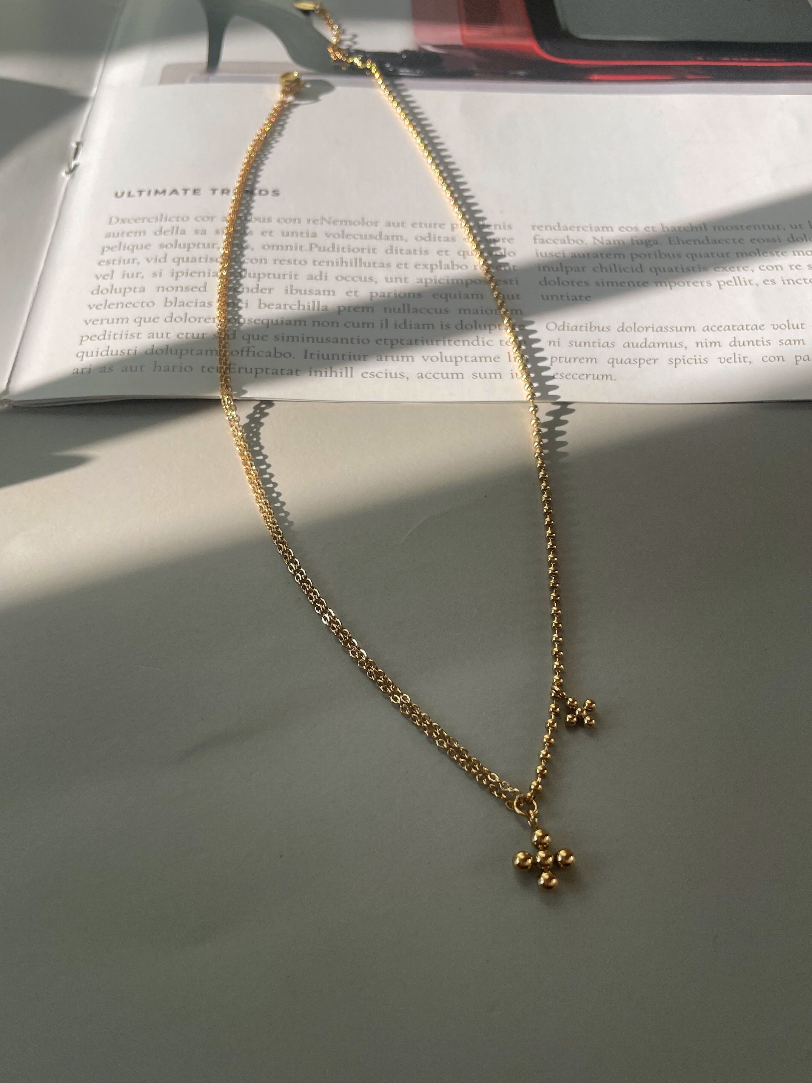 dot cross necklace