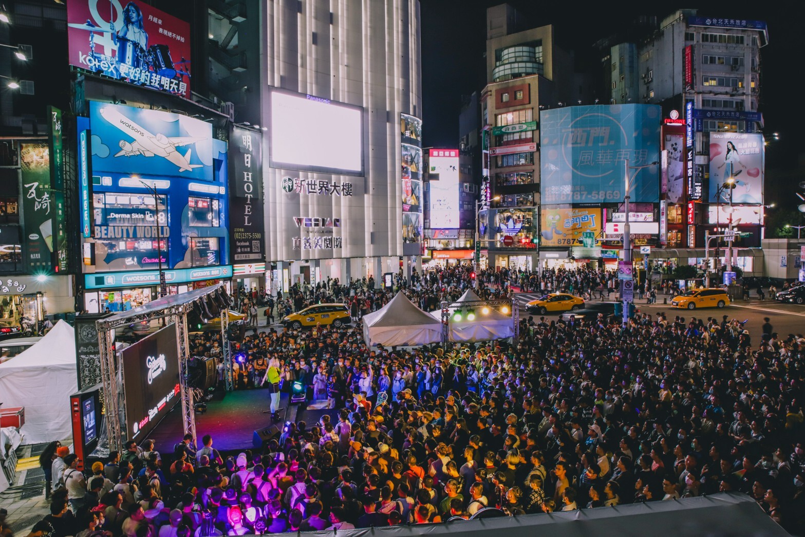 Taipei Pride Week nighttime party crowd and stage lights