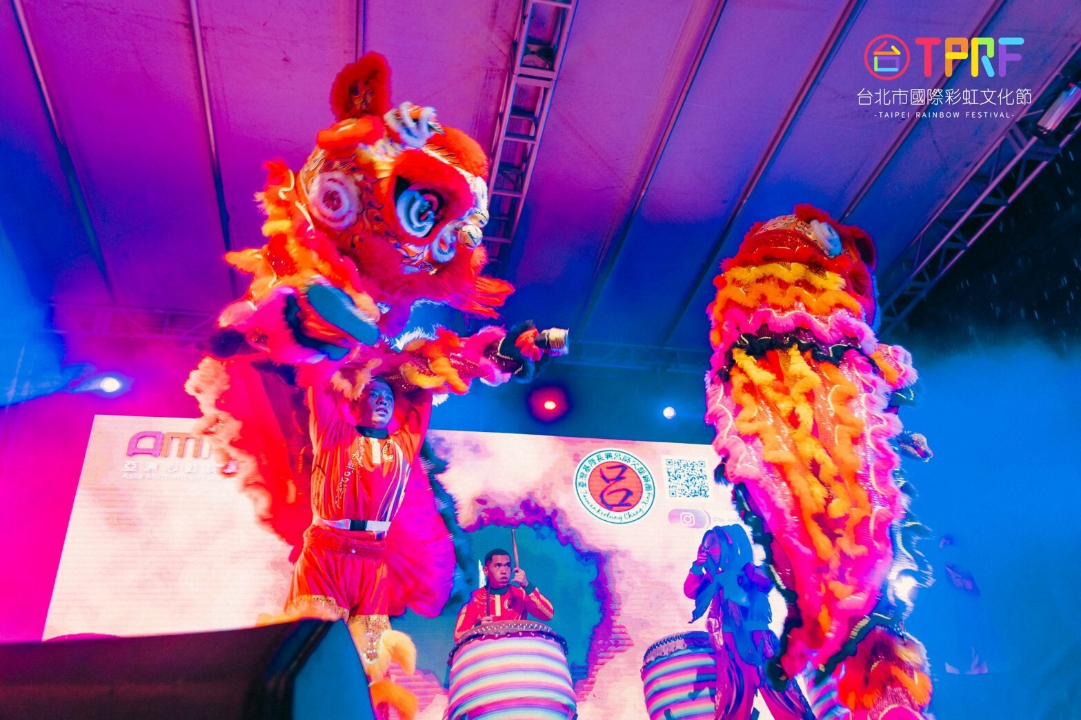 Two colorful lions in a lion dance at the Taipei Rainbow Festival