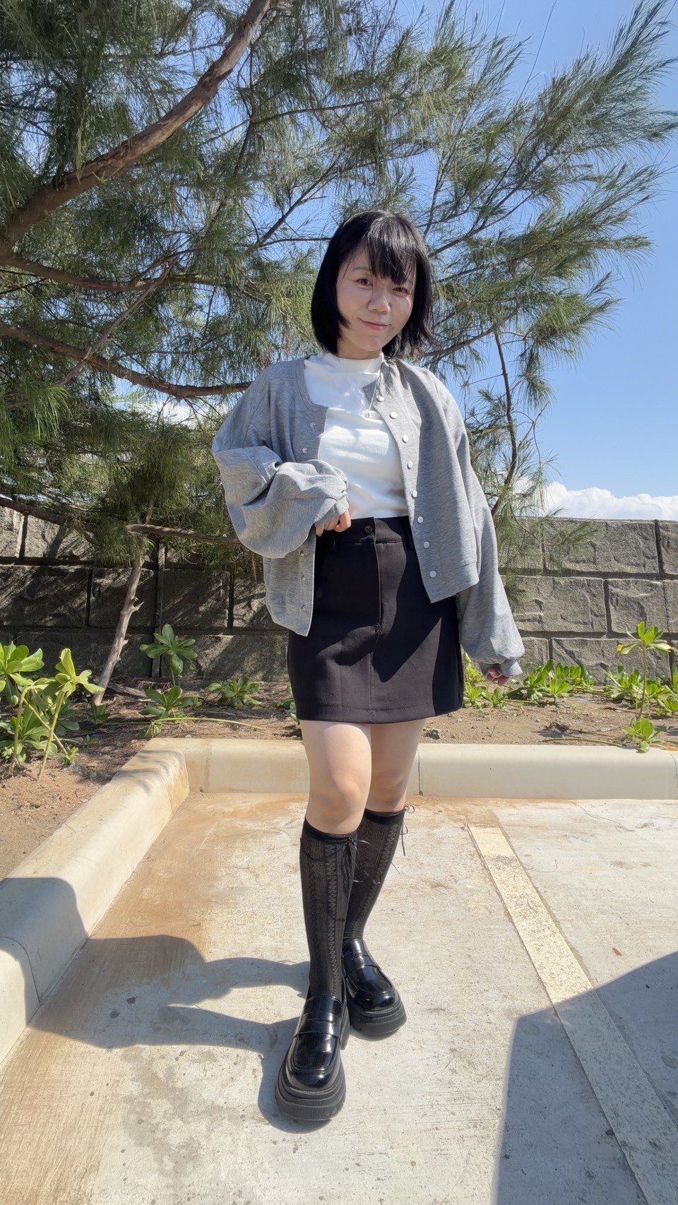 硬挺水洗西料A字裙(有安全褲