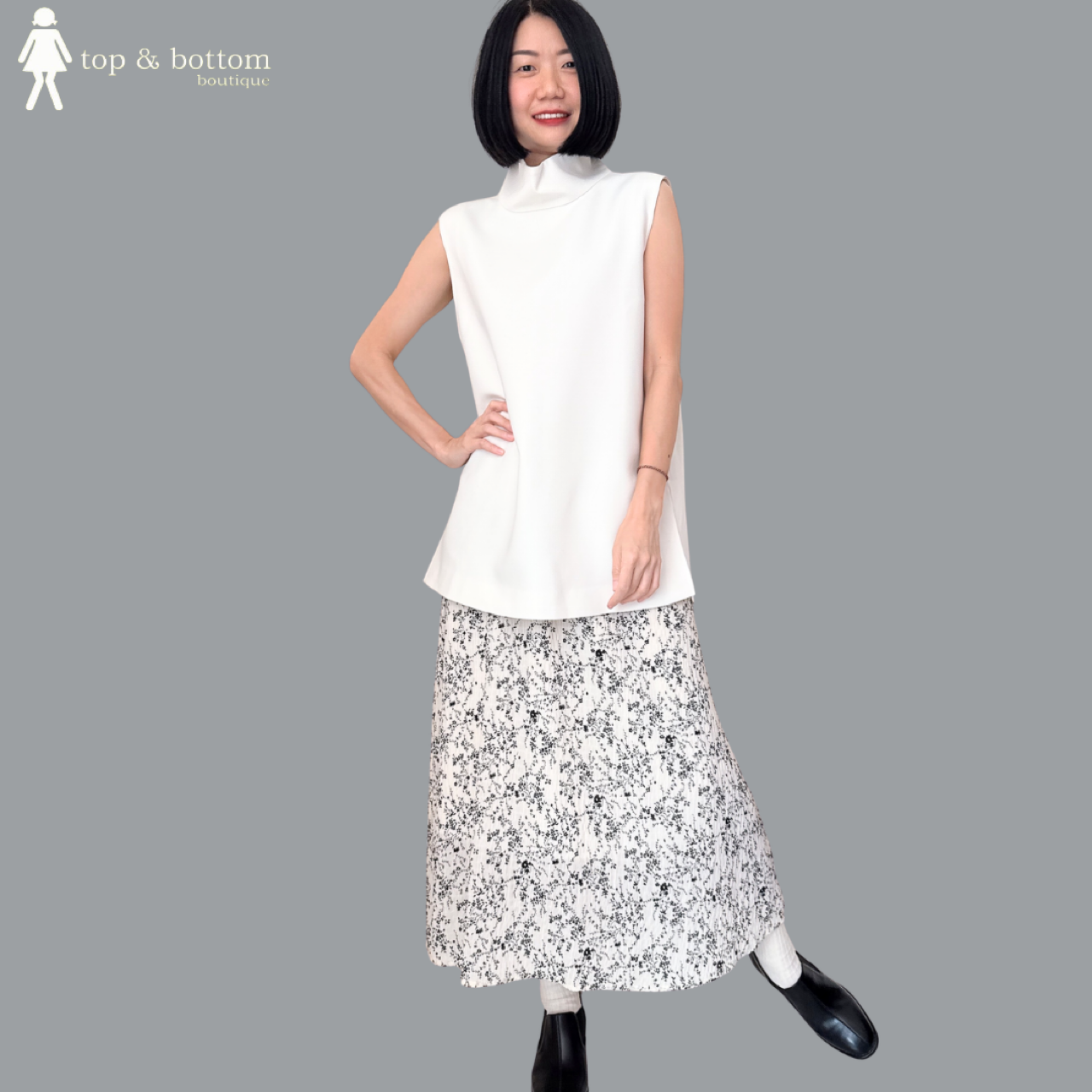 SLEEVELESS SOLID HIGH NECK LONG BLOUSE