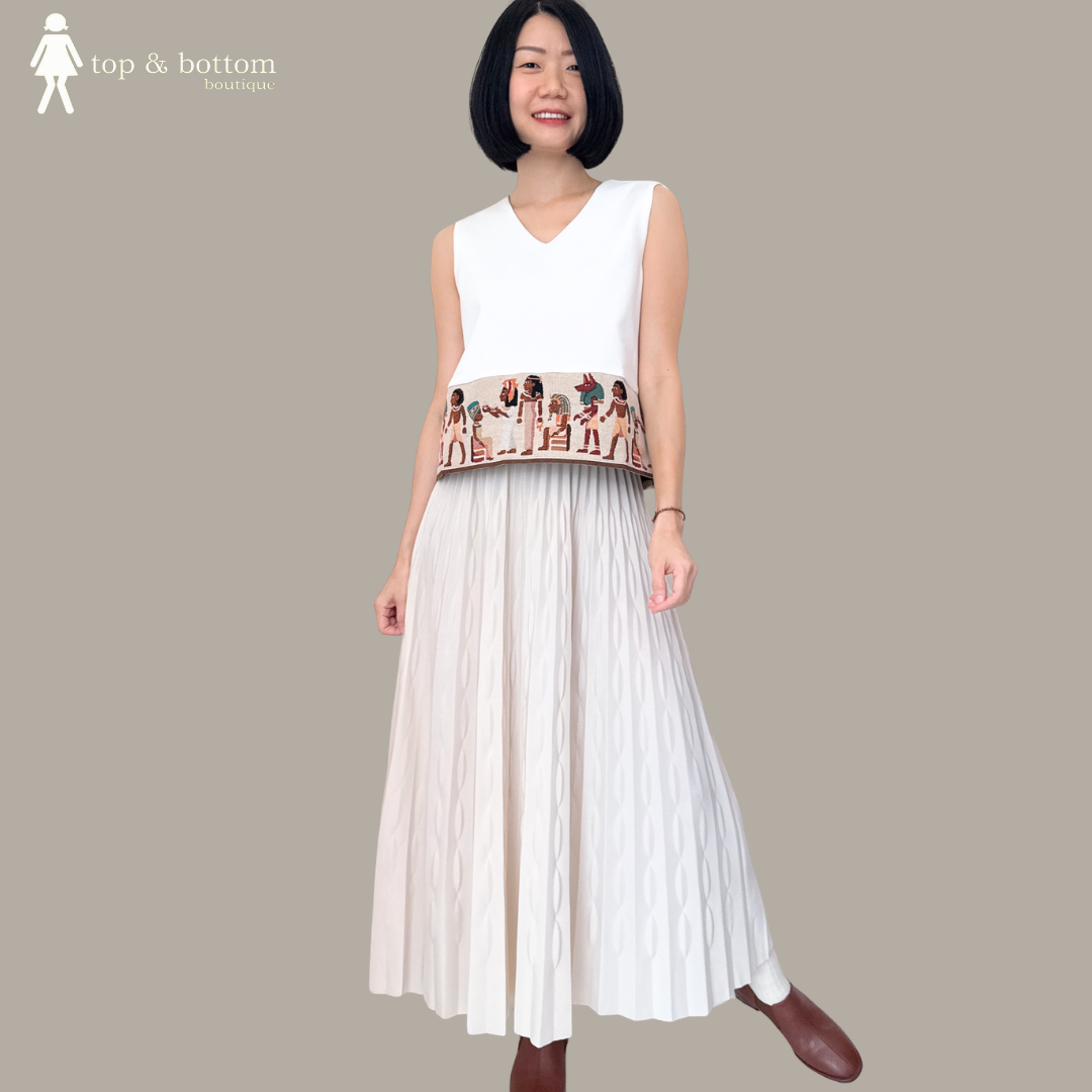 SLEEVELESS SOLID V NECK BLOUSE WITH JACQUARD HEM