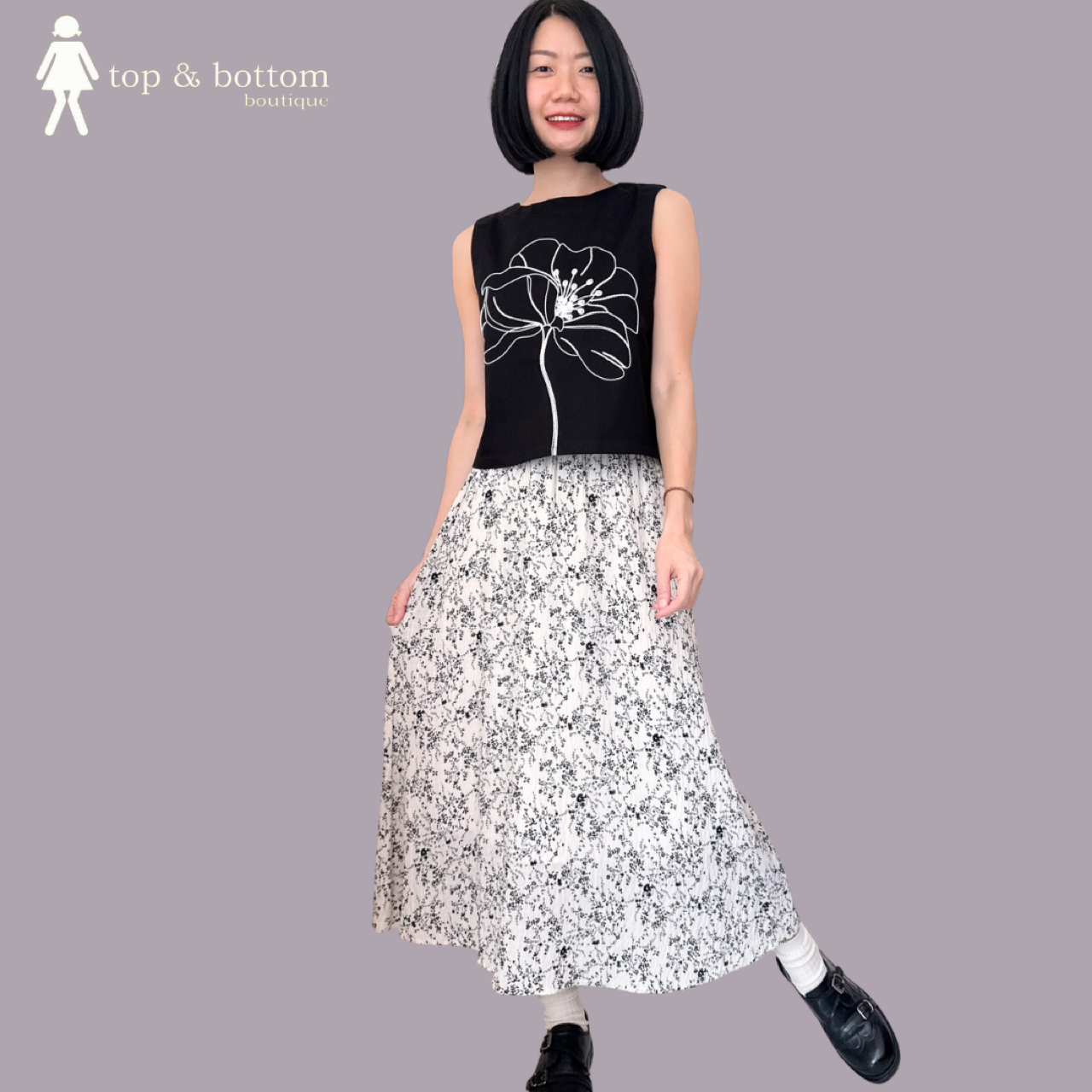 SLEEVELESS SHORT BLOUSE WITH EMBROIDERED FLOWER FRONT
