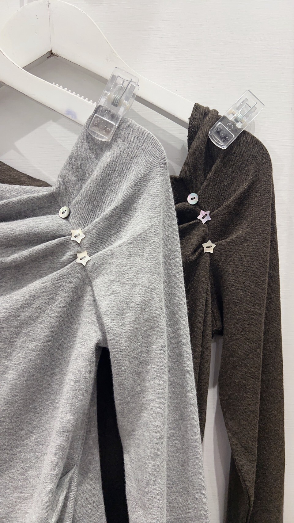 Waist-cinching asymmetric-neck top