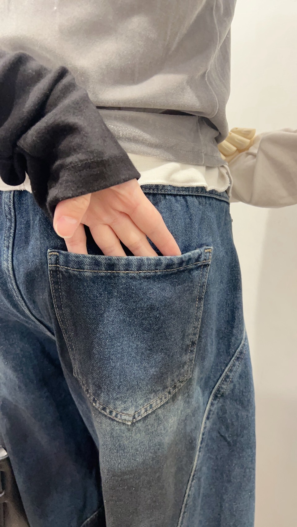 Dark-wash curved-seam jeans