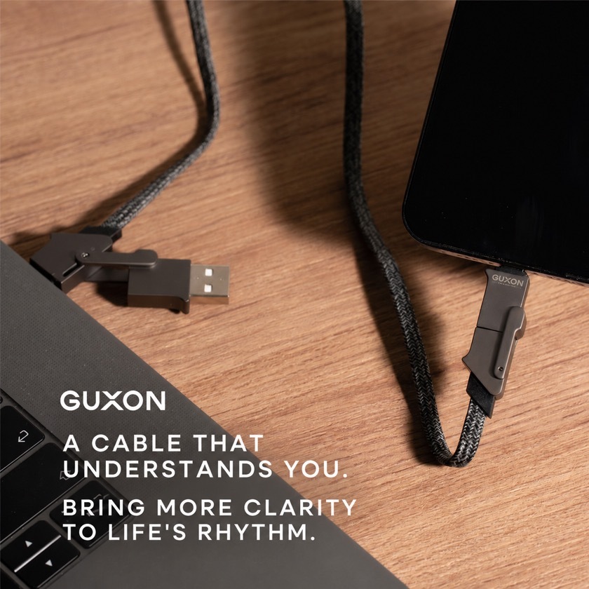 GUXON 4-in-1 cable connected to a laptop on a desk
