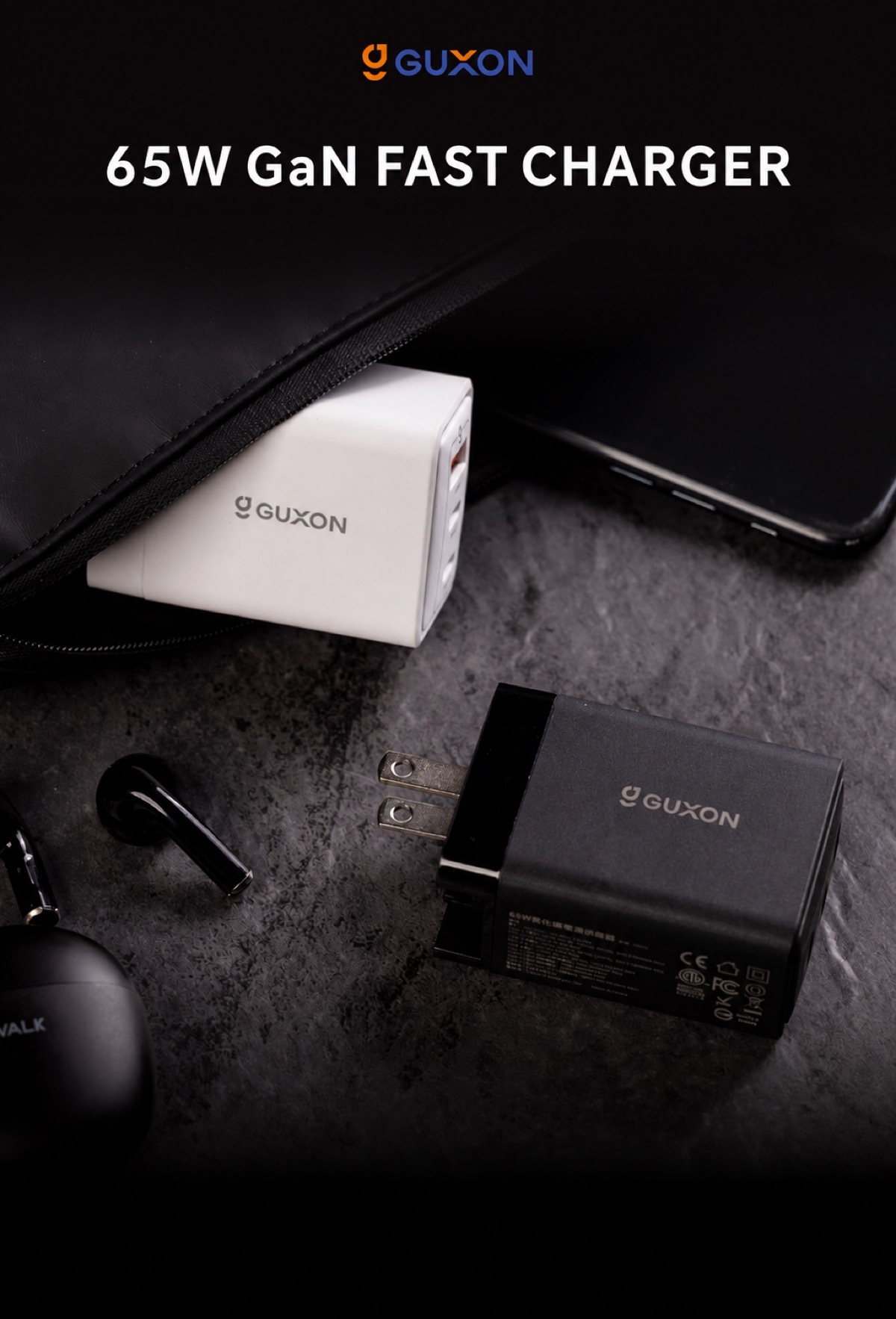 GUXON 65W GaN fast charger in black and white, shown with a laptop sleeve