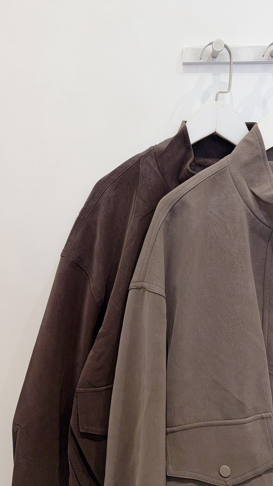 Shop girl keeps her suede jacket